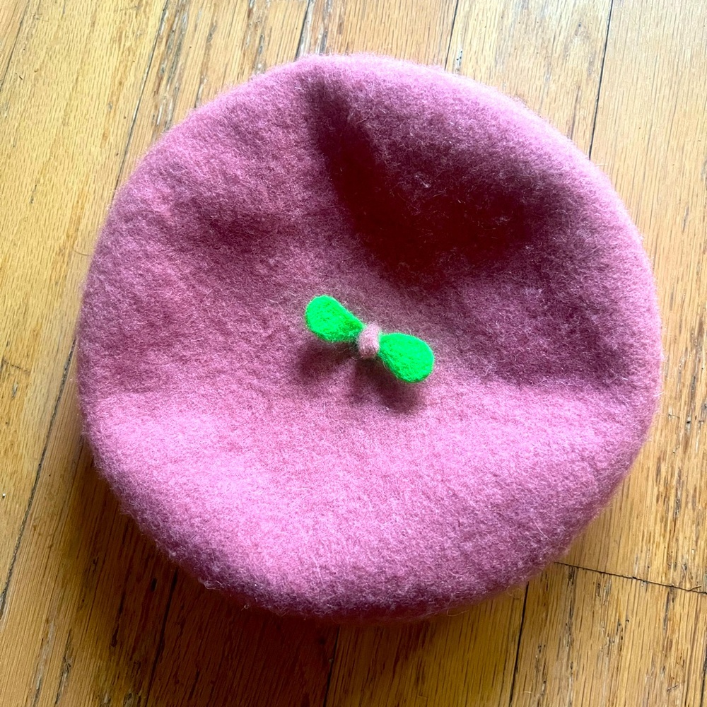 Pink chic beret with a tiny plant accent